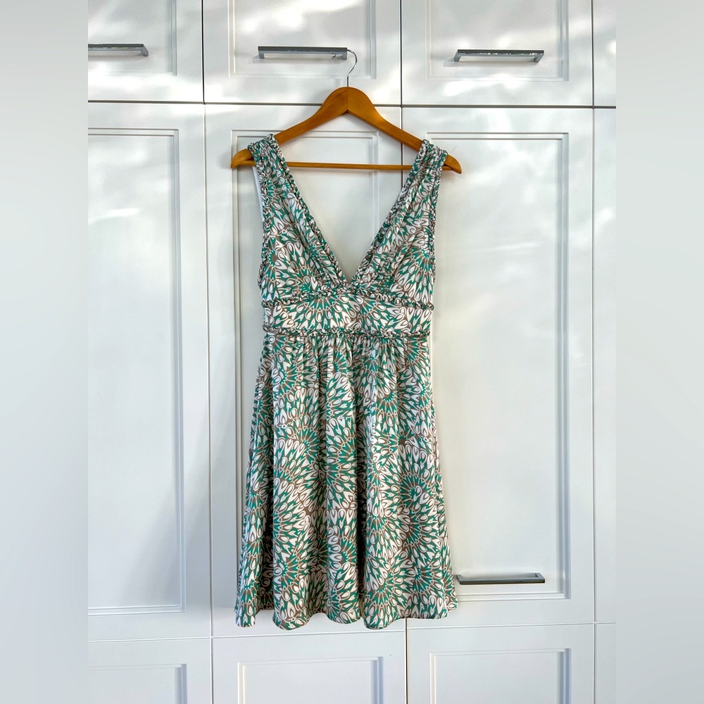 BCBG low cut sleeveless mini dress with white, green, and light brown print
